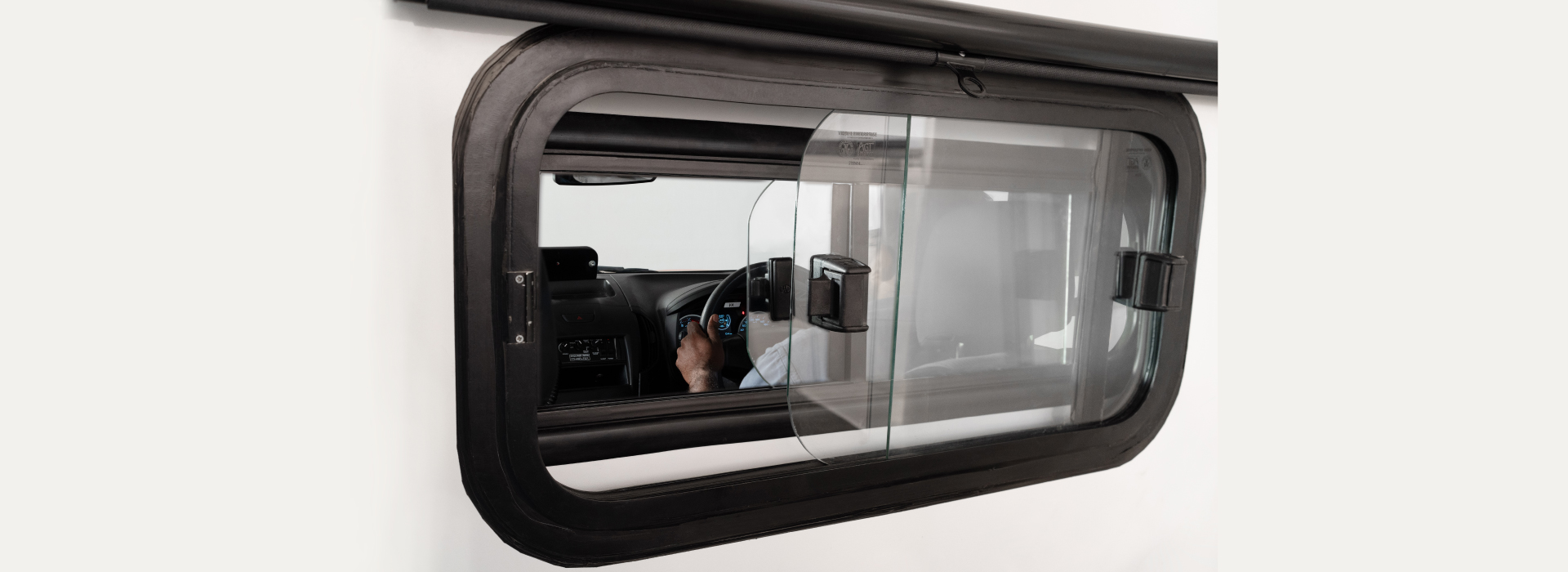 Sliding window with driver compartment with privacy curtain